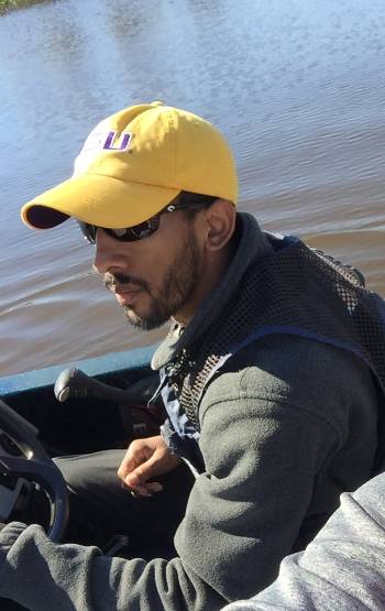 Electrical Engineering major and Baton Rouge native Togma “Taj” Chauvin takes his teammates and instructor for a ride on his boat to showcase their senior design project, The Jack Hombres.
