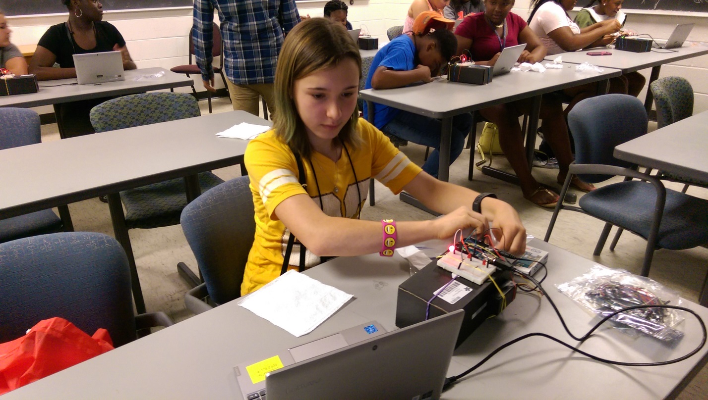 A participant at the Louisiana 4-H Clover College “Tracking Toxins:  Shining Light on Pollution” session, held June 21-22, 2018 at Louisiana State University, building a particulate matter (PM) detector.  