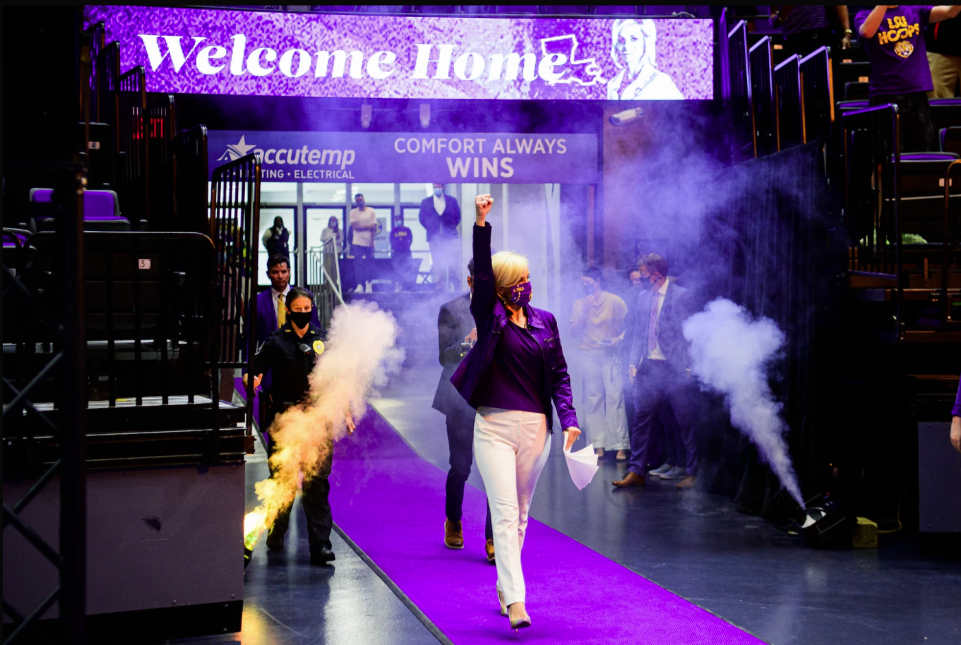 Coach Kim Mulkey excitedly enters the PMAC during her introductory press conference. 