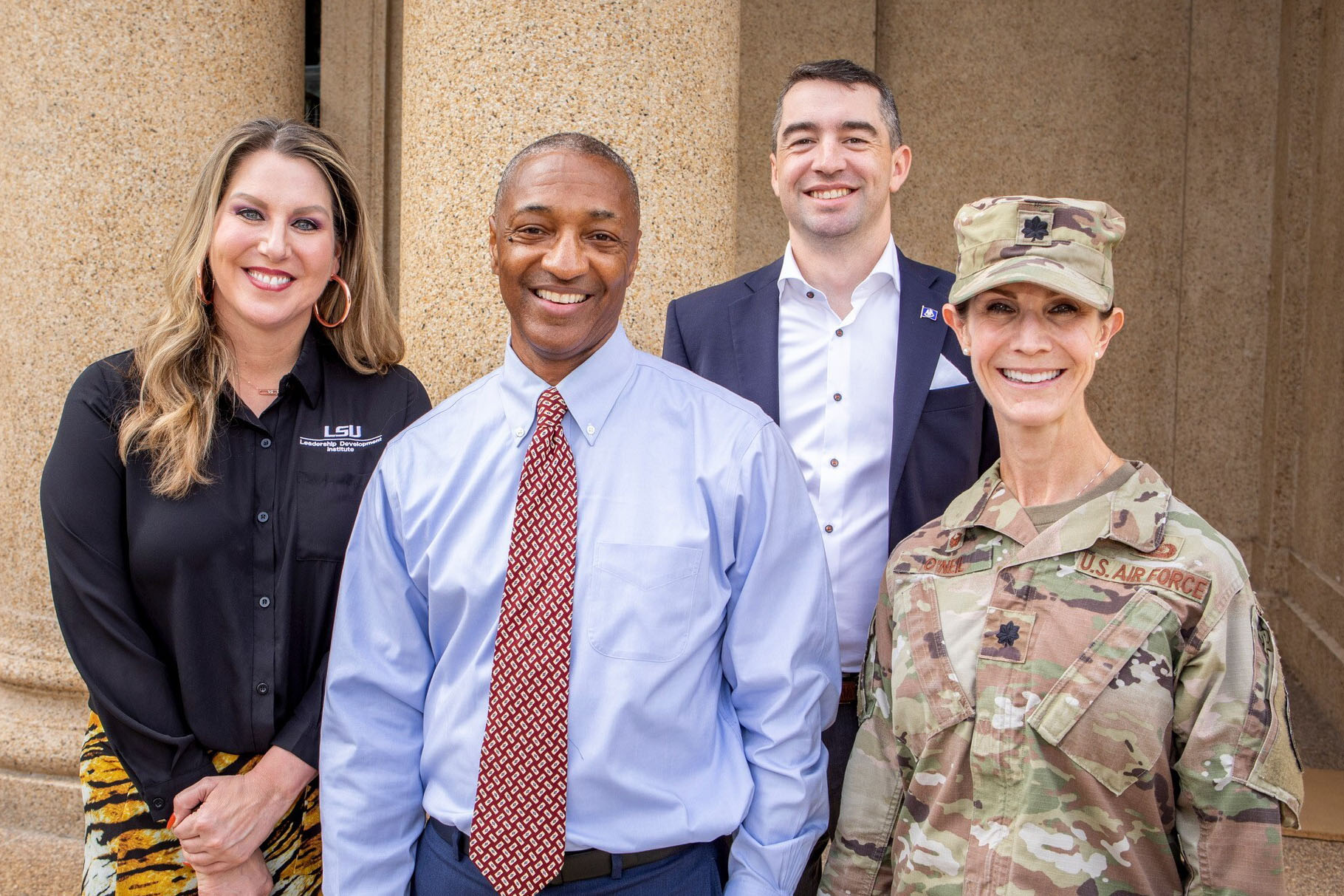 Col. Lisa O’Neil with LSU President William F. Tate IV and others.