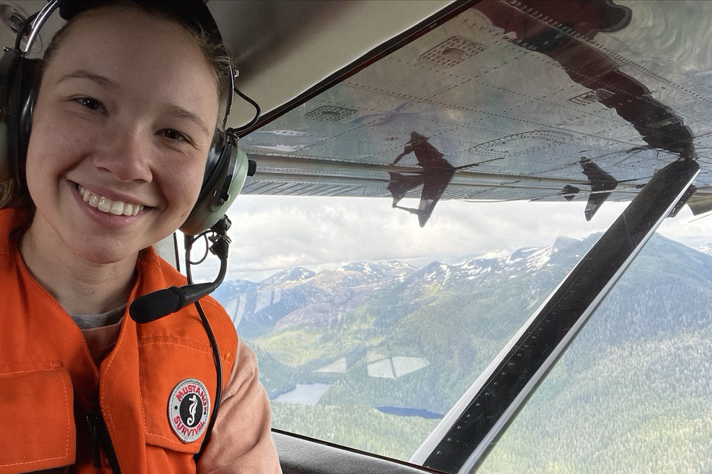 Elizabeth Cuccio in plane flying over mountains