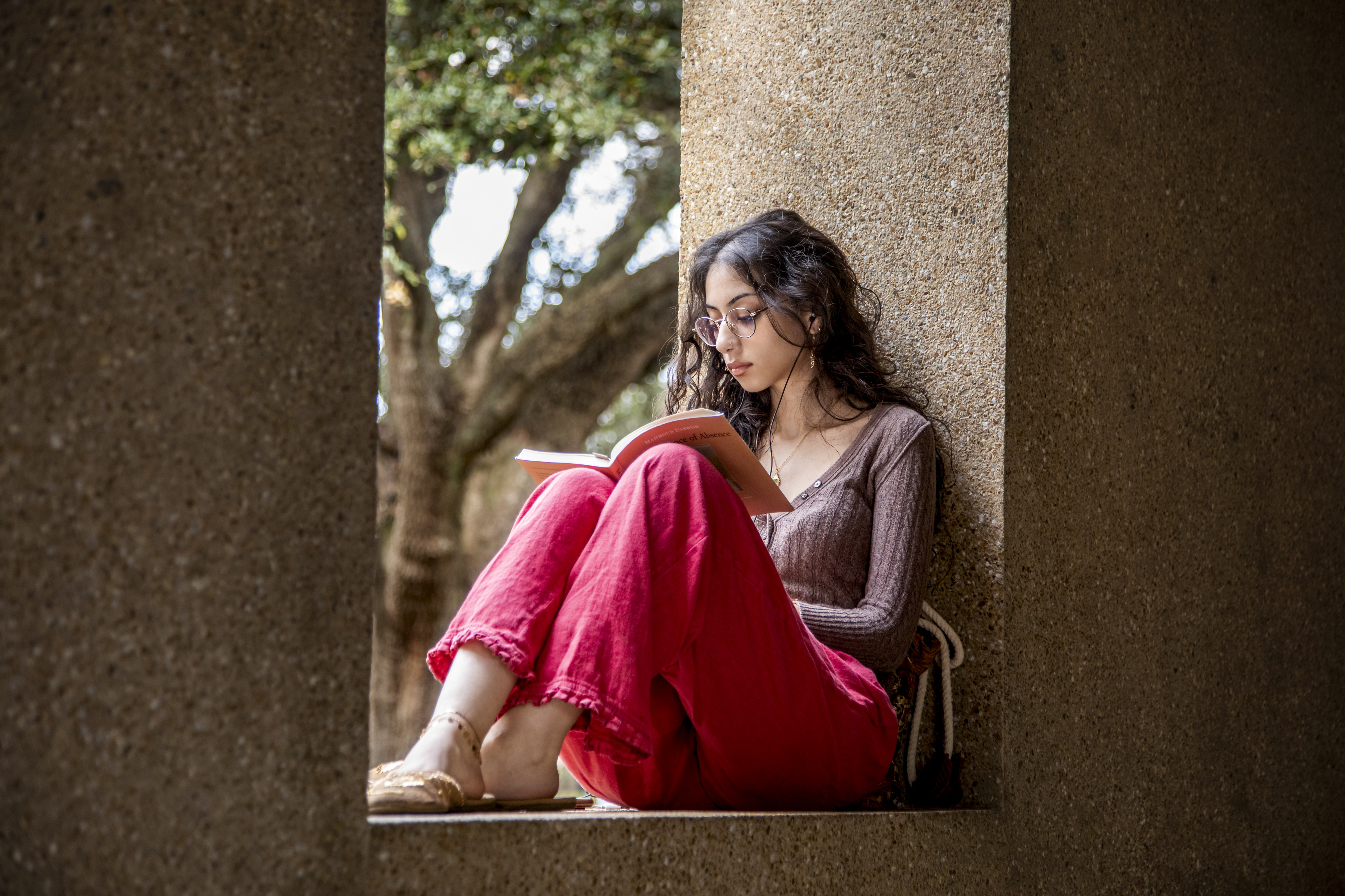 Student reading on the first day of classes