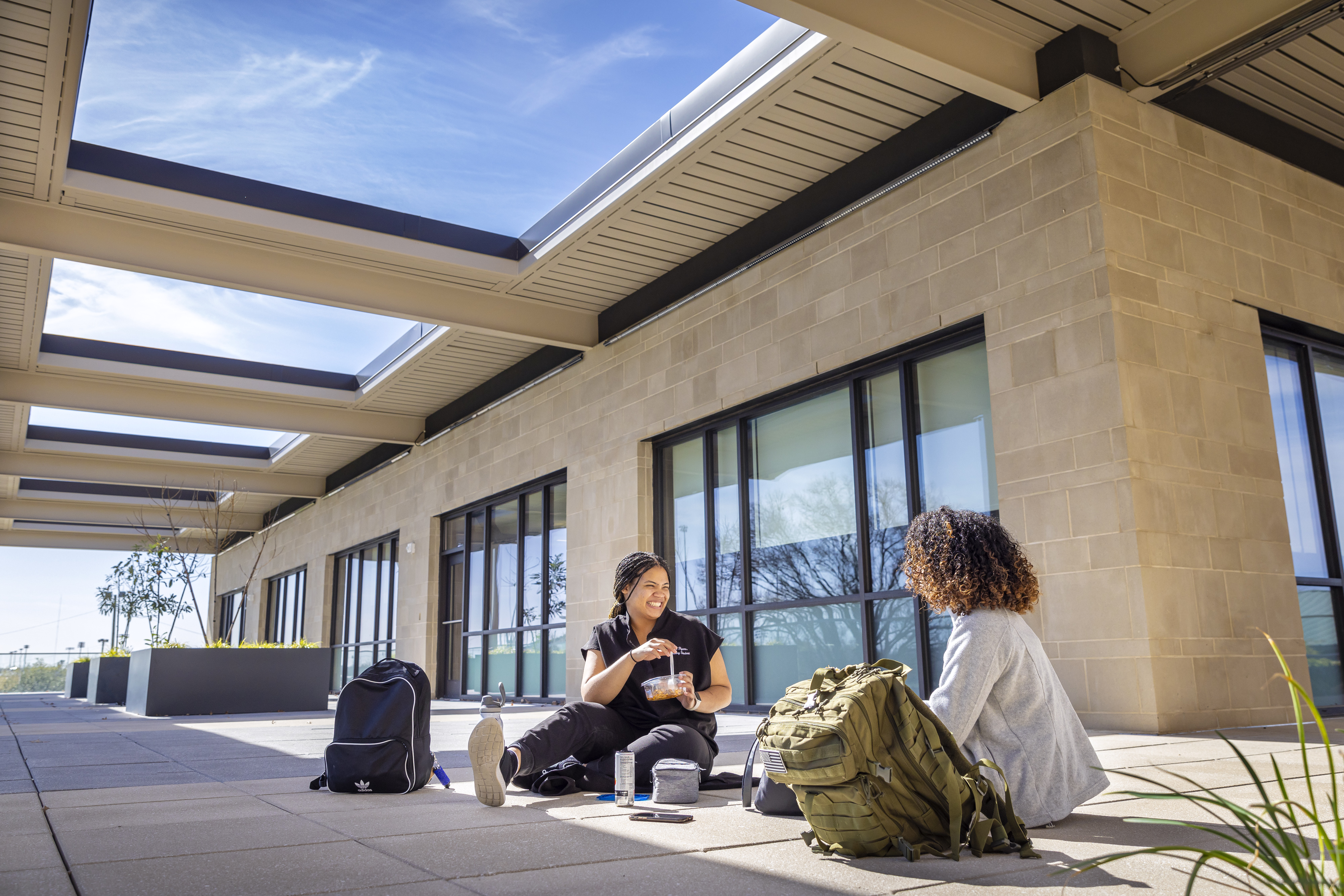 Students sitting on rooftop terrace