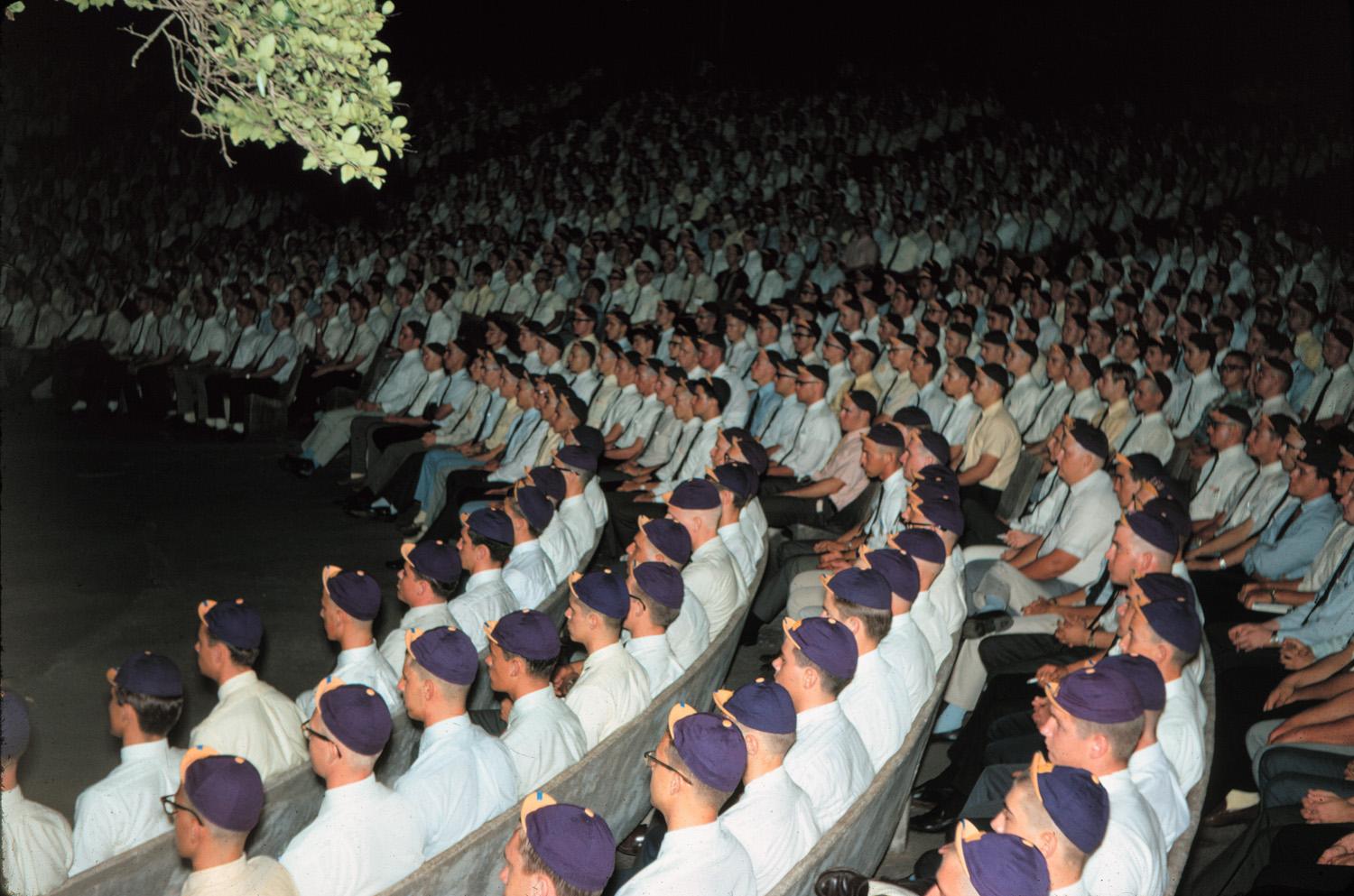 Freshmen males meet to “learn the ropes” about being a Tiger in 1966. Thankfully, the tradition of purple and gold beanie caps is no longer followed.