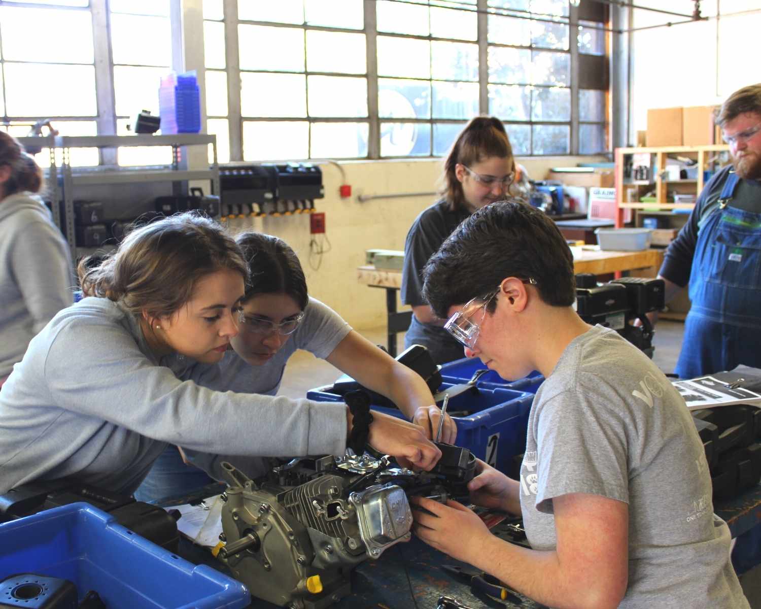 students working on engine