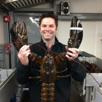 dennis holding crab