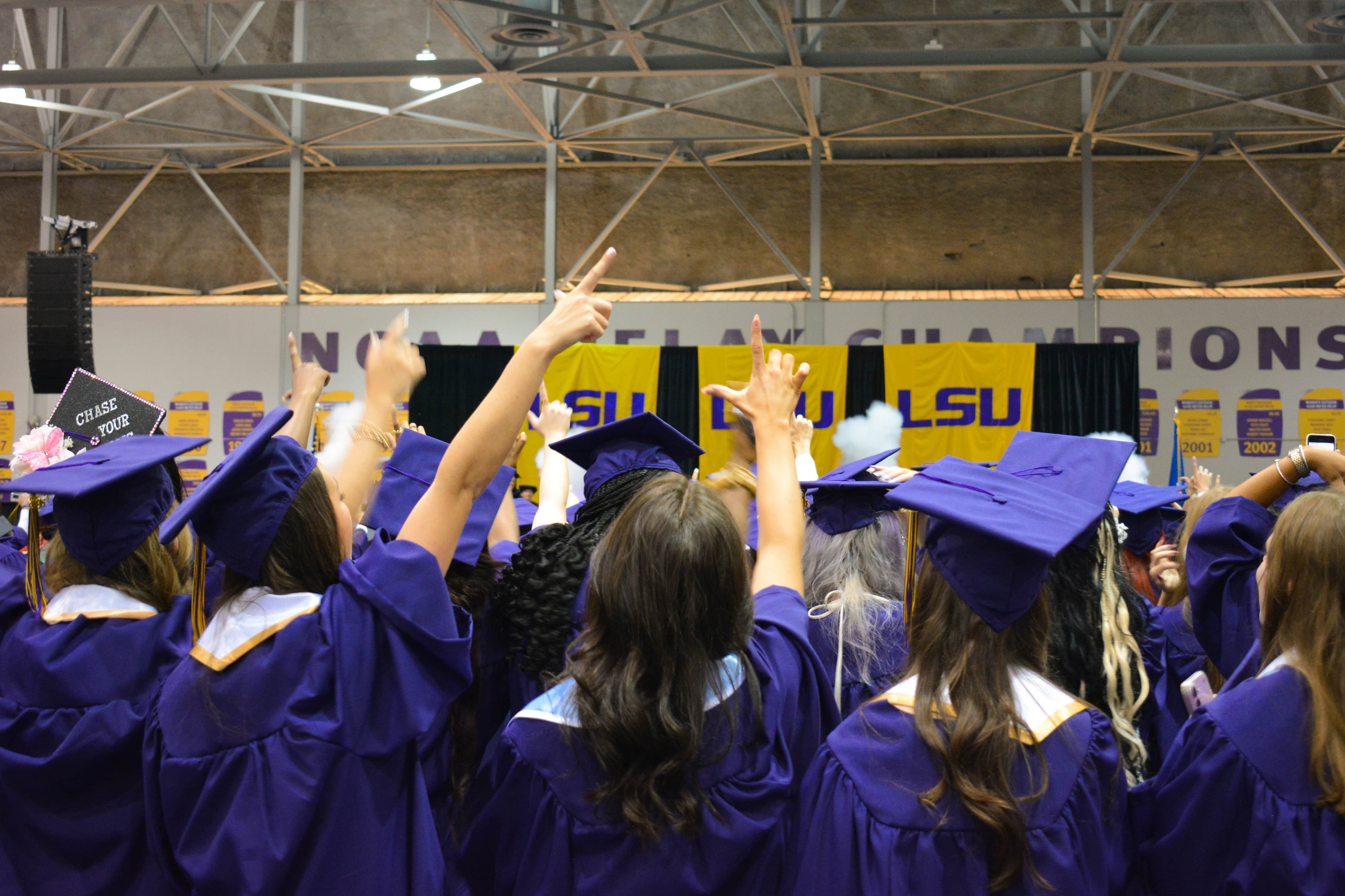LSU Grads celebrating during the singing of the Alma Mater. 