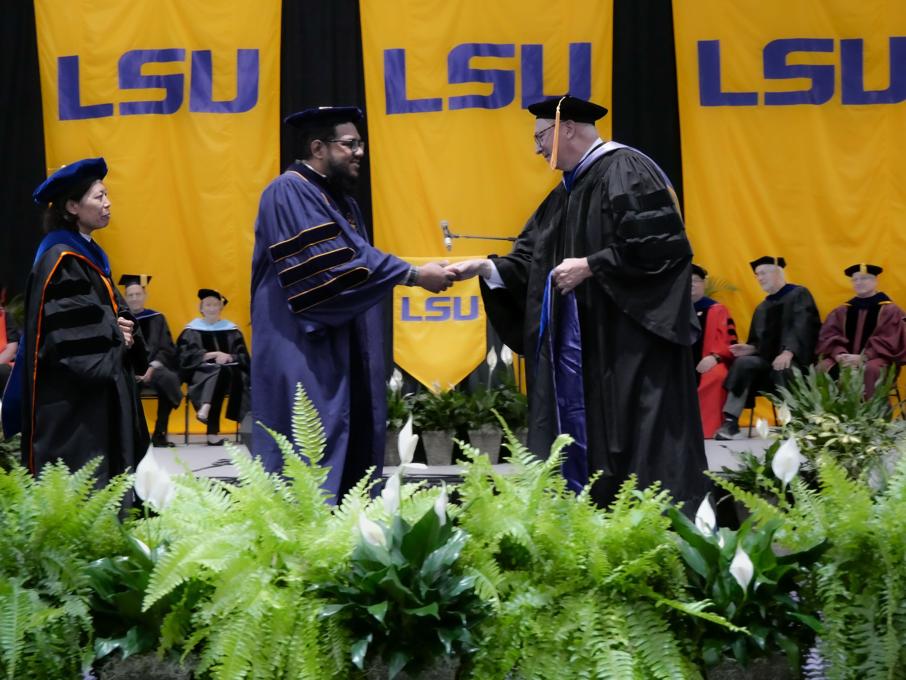 Graduate receives doctoral hood