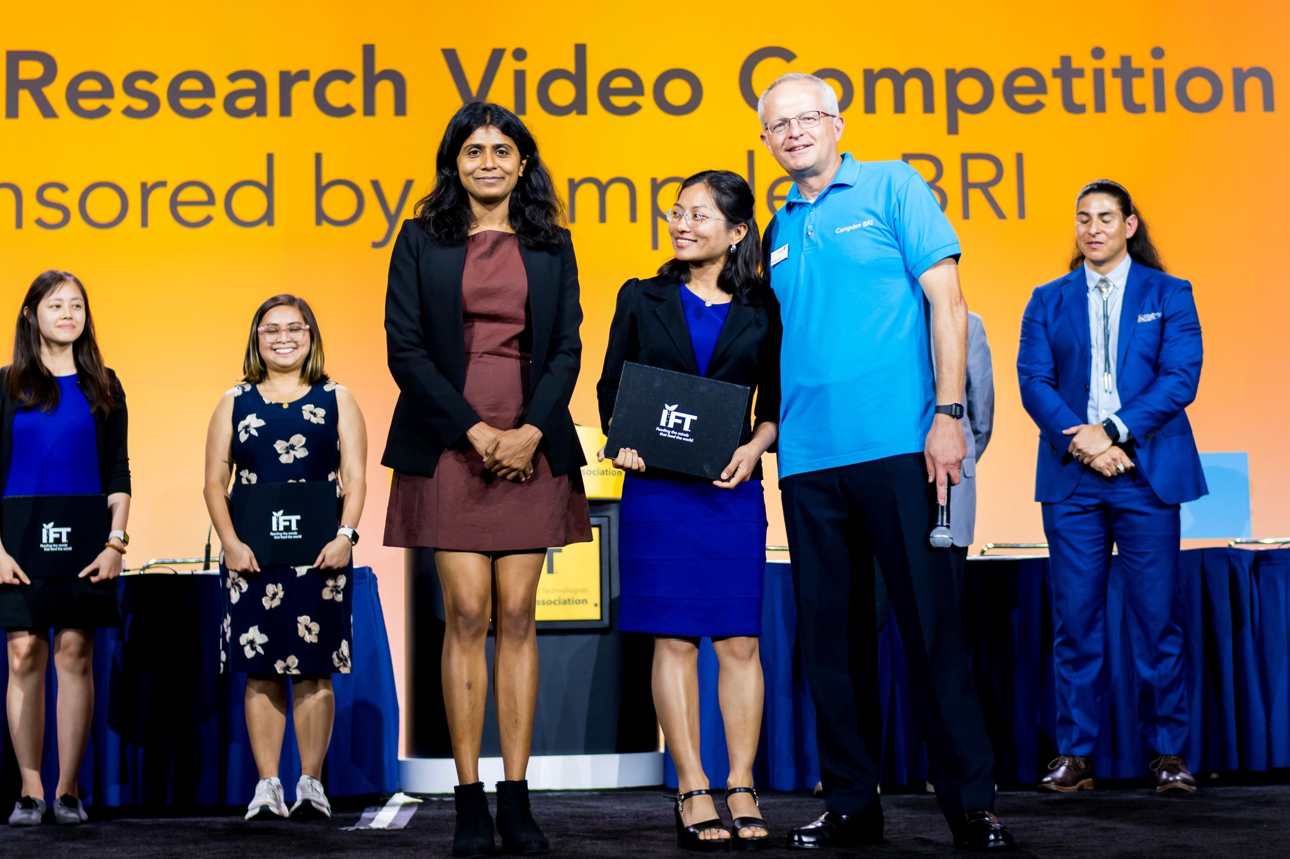 Group of people receiving award