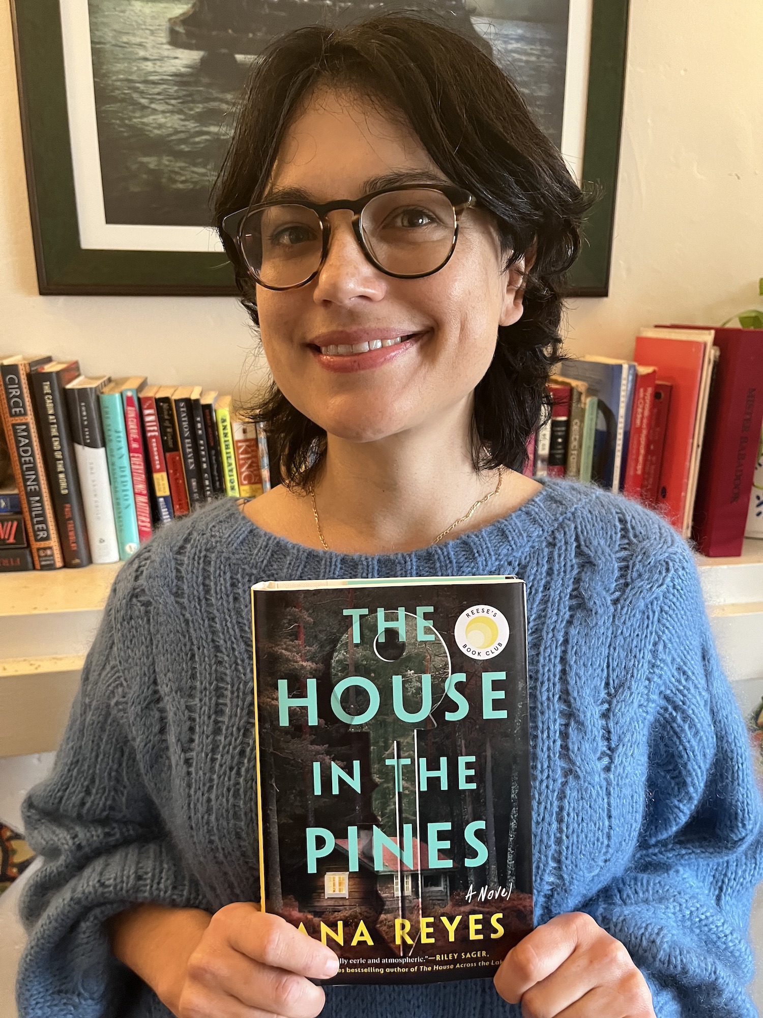 Author Ana Reyes poses with her new book 