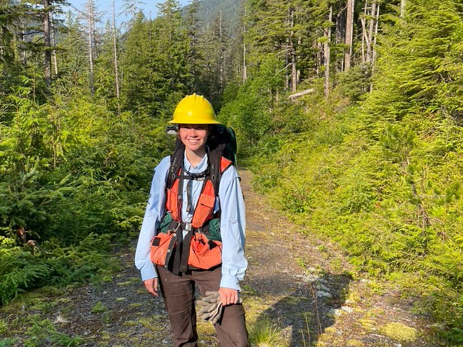 Student Elizabeth Cuccio on a wooded trail in Alaska