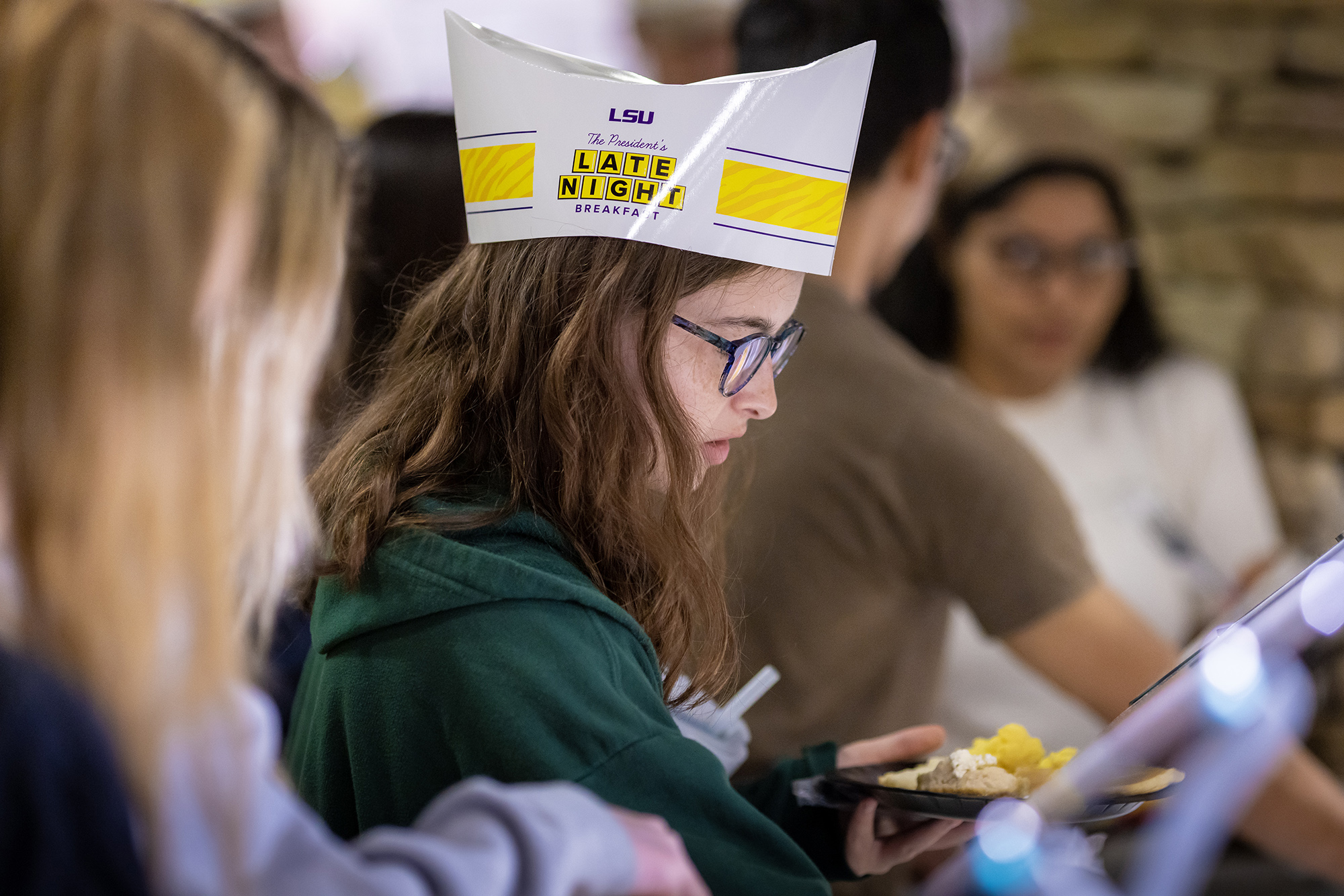 LSU student fixes a plate of food at the President's Late Night Breakfast