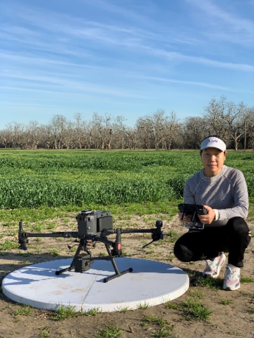 Shelley Meng poses with a drone 