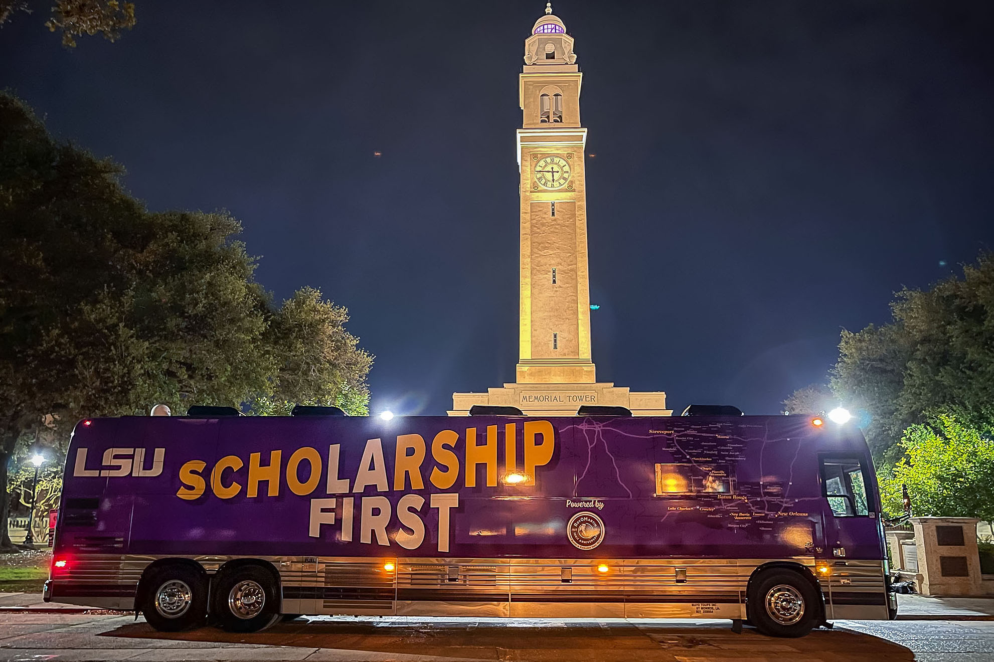 Scholarship First bus in front of Memorial Tower on the LSU campus