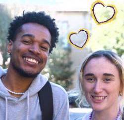 Two students smile with cartoon hearts above their heads