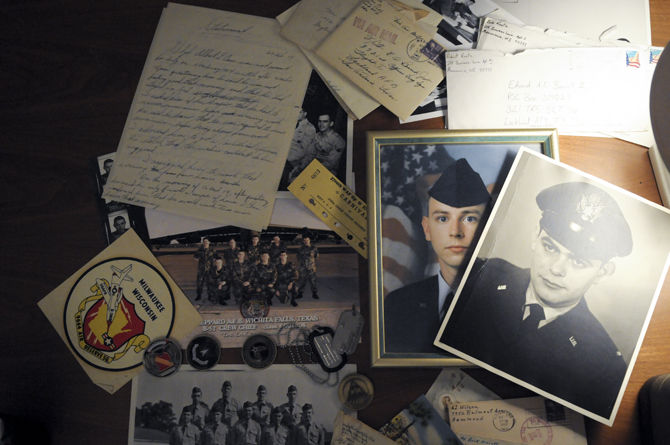 Artifacts from military service like photos, letters and medallions 