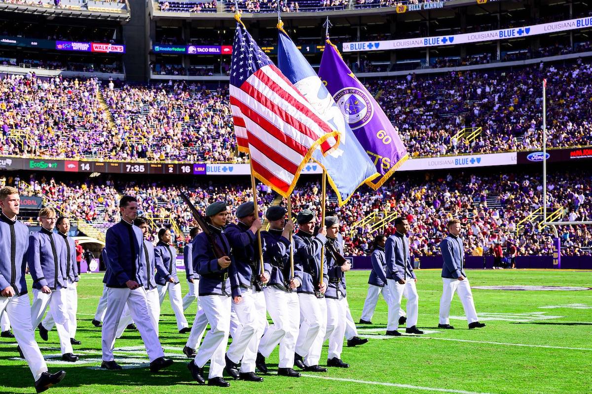 LSU students in the Corps of Cadets on the football field in Tiger Stadium