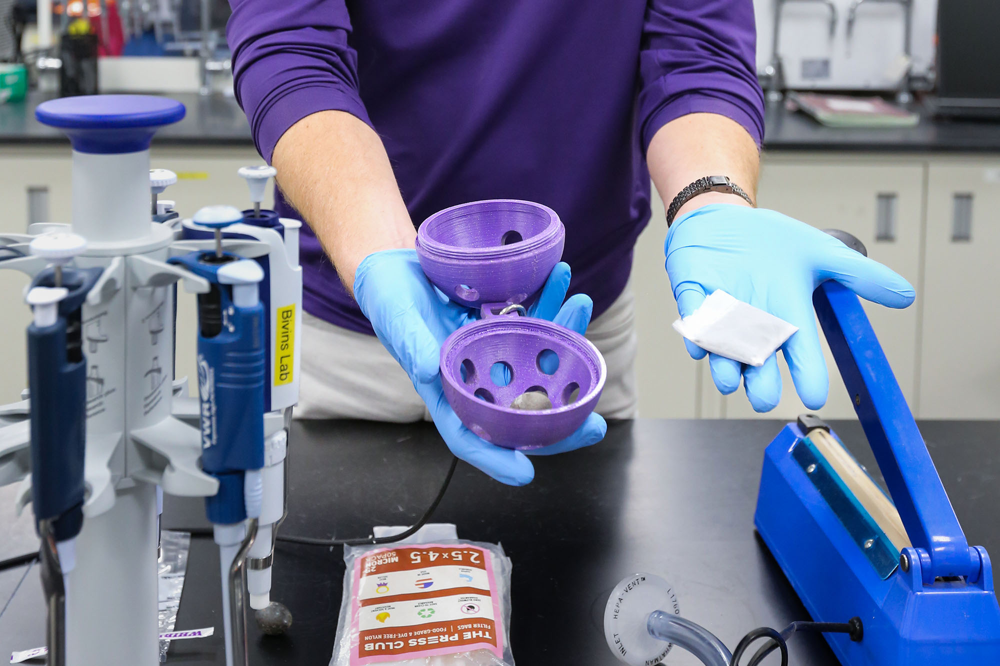Closeup of the sewage sampler device in a lab.