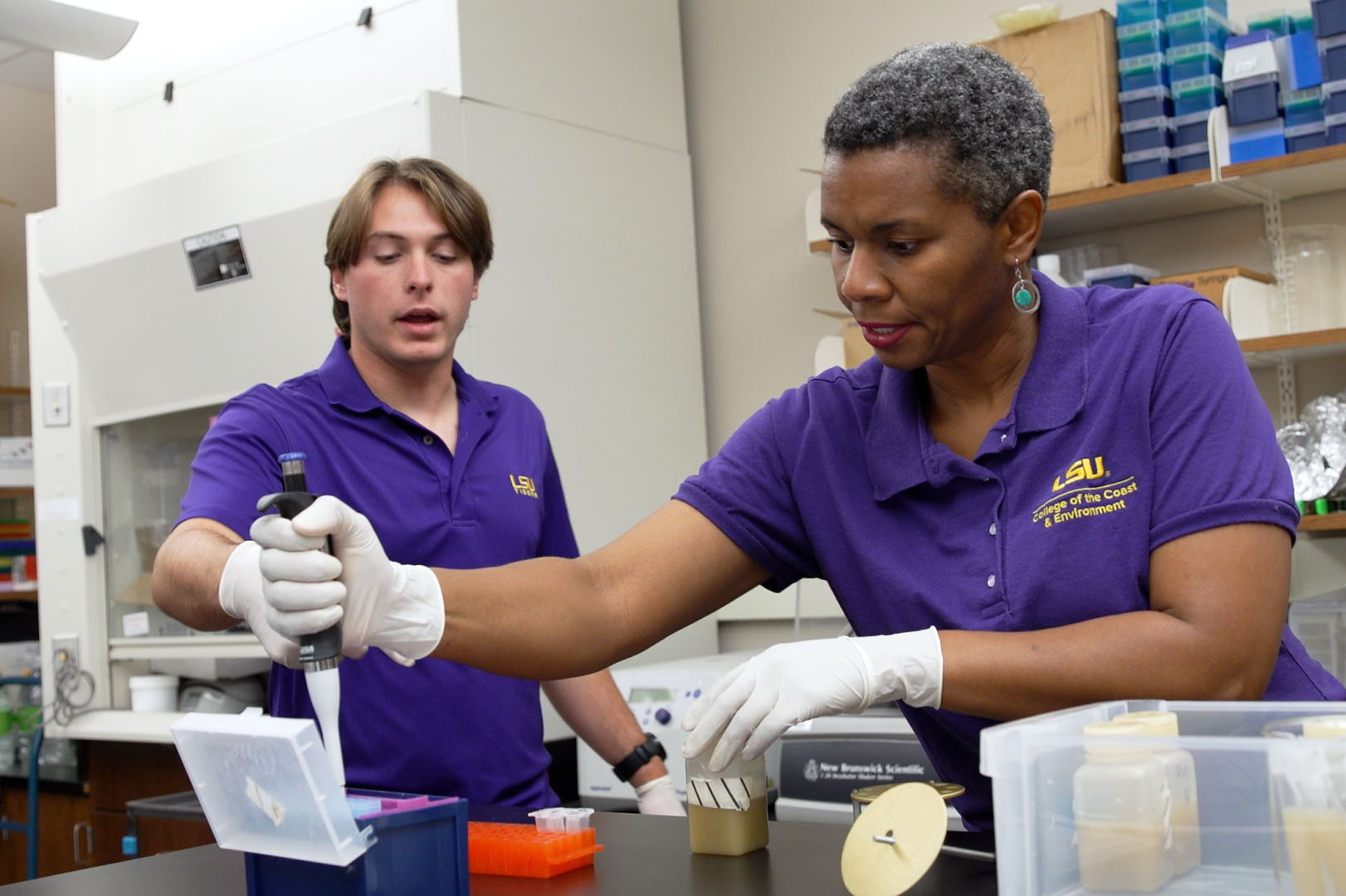 Dr. Crystal Johnson, Associate Professor in the LSU College of the Coast & Environment, and student researcher Andrew Schwartz examine vibrio-containing water and oyster samples.