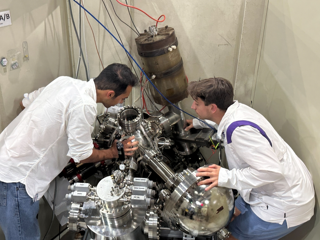 Chemical Engineering graduate student Ali Parastesh and Physics undergraduate student Josh Chesel work on the EUV system at Louisiana Light Source.