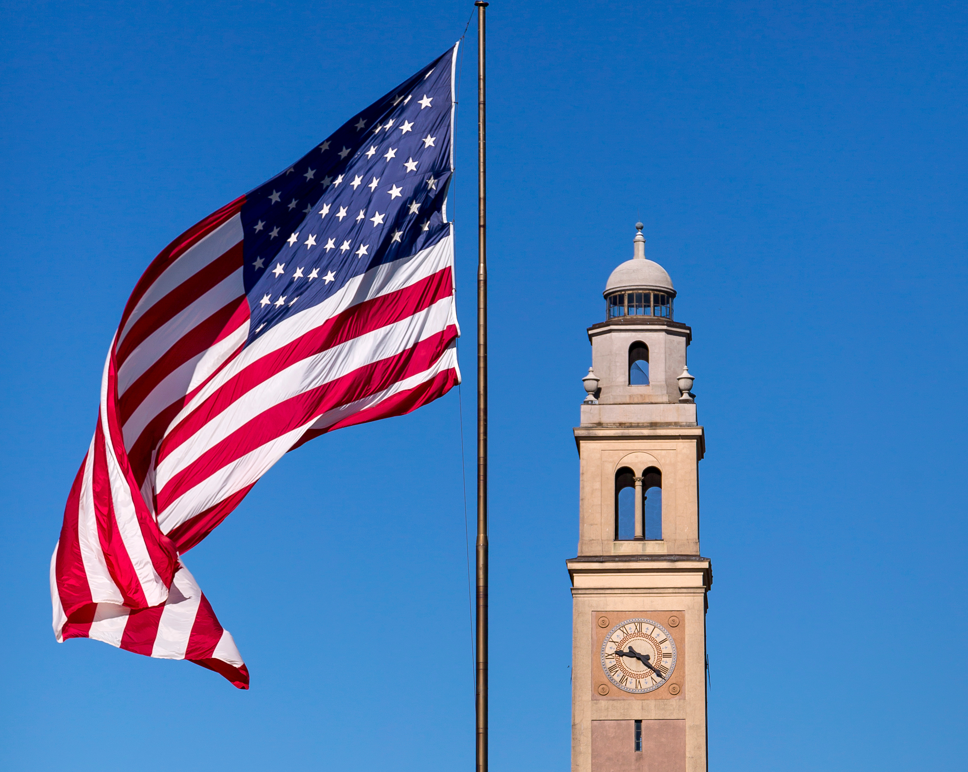 American flag in front of LSU's Memorial Tower