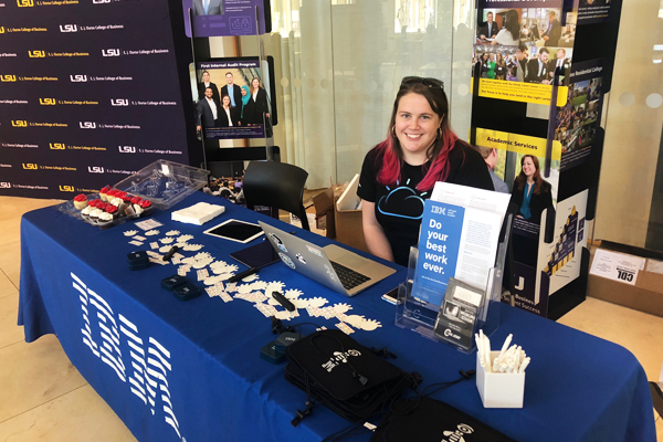 representative from IBM sitting a promotional table