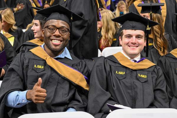two male students at graduation