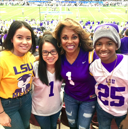 Sonja Wiley enjoys an LSU football game with her two daughters and son.