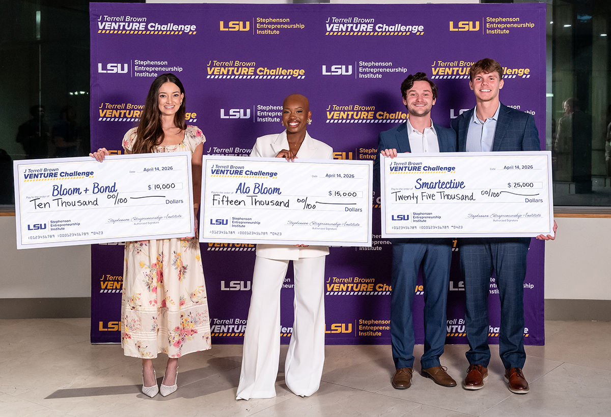 J Terrell Brown Venture Challenge winners and their large cardboard checks