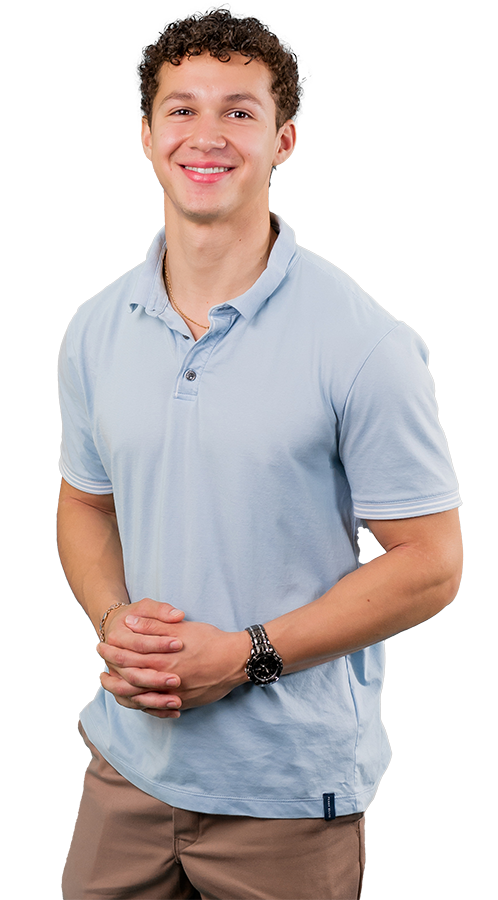 Fernando Carcamo Soler headshot he wears a pale blue polo and khakis. His hair is curly and his smile is bright.