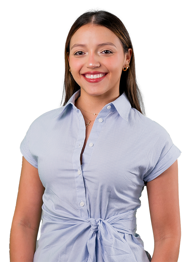 Maria Anzola headshot. She wears a blue and white wrap blouse and smiles warmly. Her hair is straight and long.