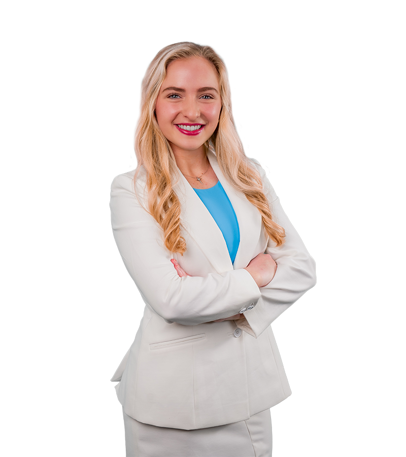 Christen Chehardy wears a white blazer and aqua shirt in this headshot.