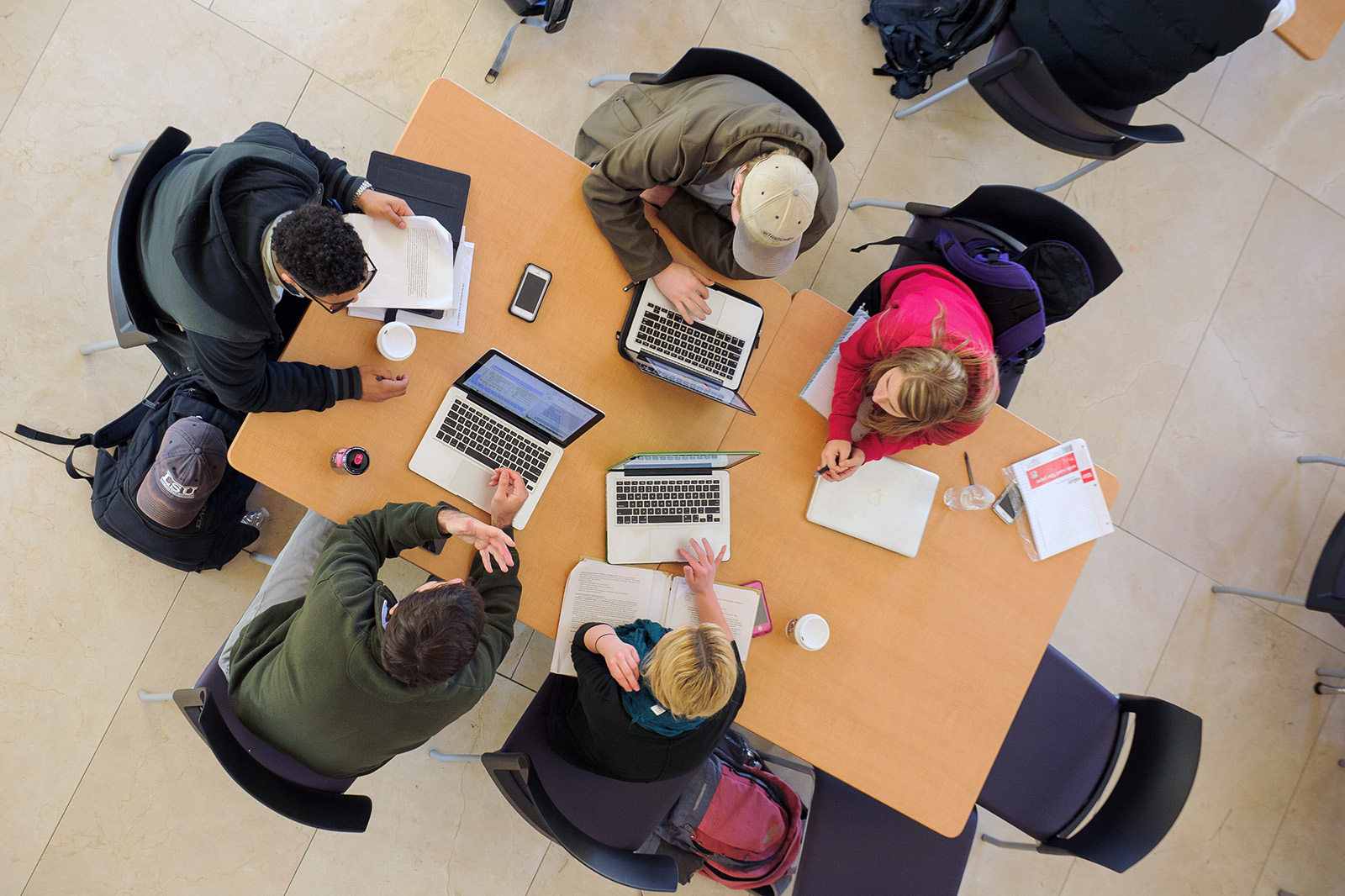students on laptops viewed from above