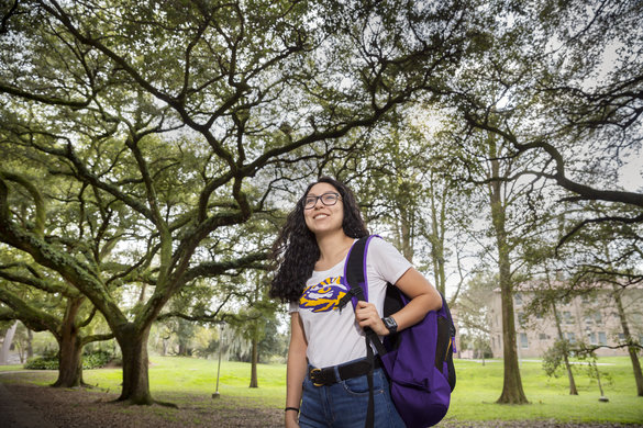 LSU Student Walking in Enchanted Forest