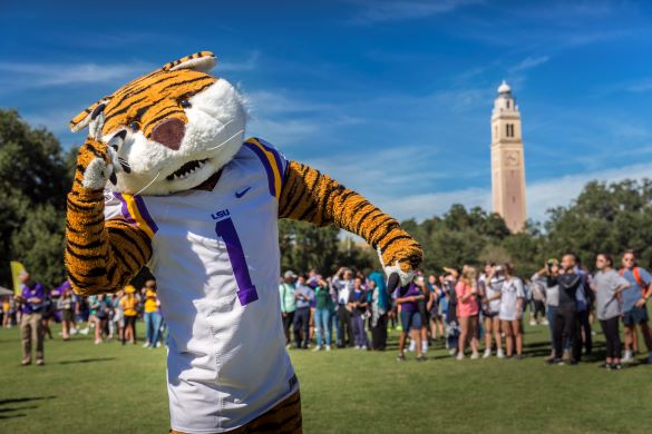 Mike the Tiger gives a "We're No. 1" sign oustide of Memorial Tower