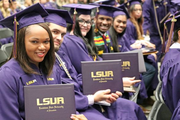 LSUA graduates pose with their diplomas during the university's commencement exercises 