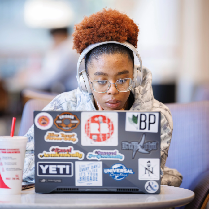 Student on laptop in Student Union