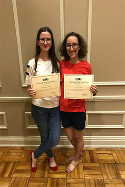 Kristina Plunkett and Macy Allen holding their outstanding student worker awards