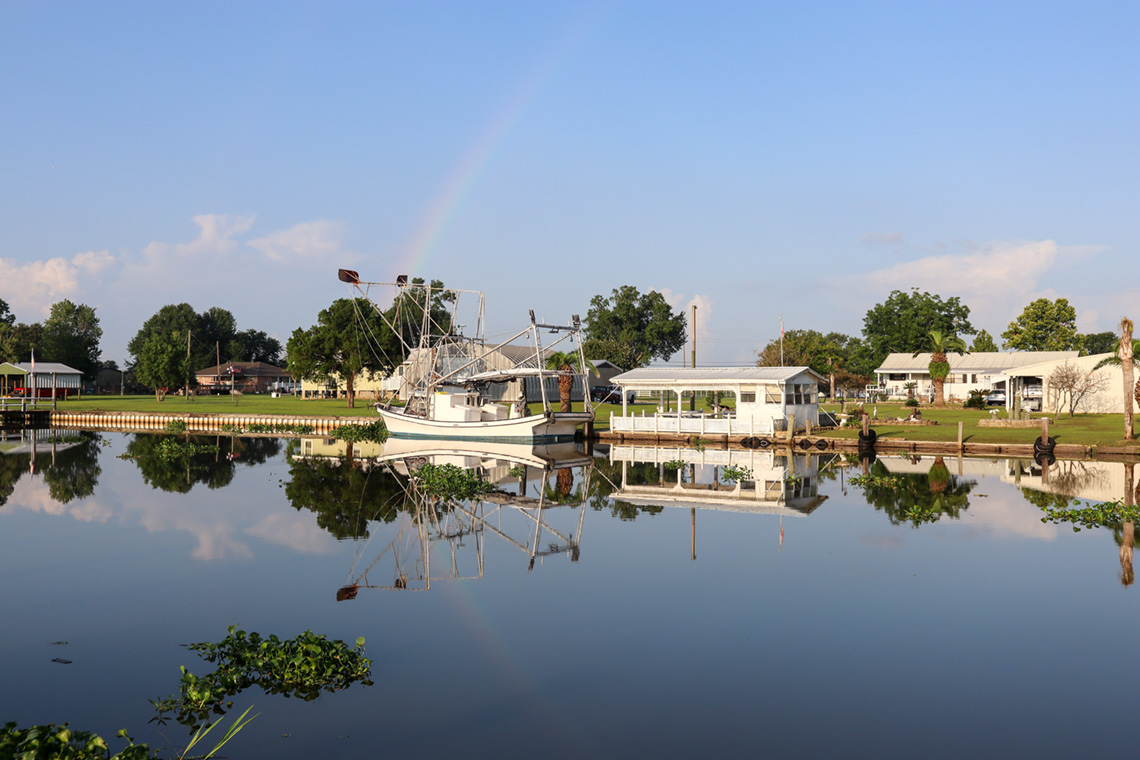 a shrimp boat in a canal