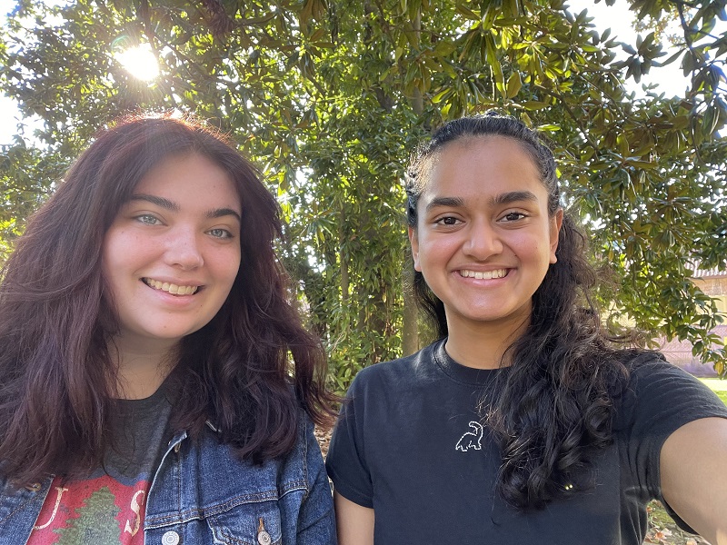 two smiling women outdoors