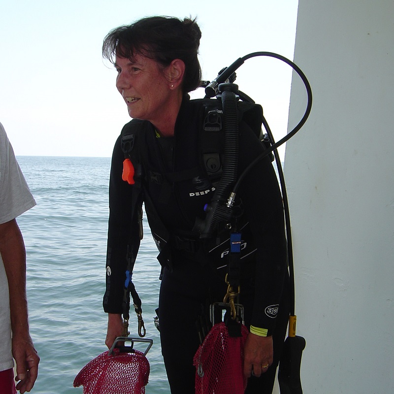 Nancy Rabalais in scuba gear on the deck of a ship