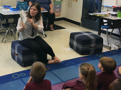 Photo of Madison Liggio reading a story to her pre-k class