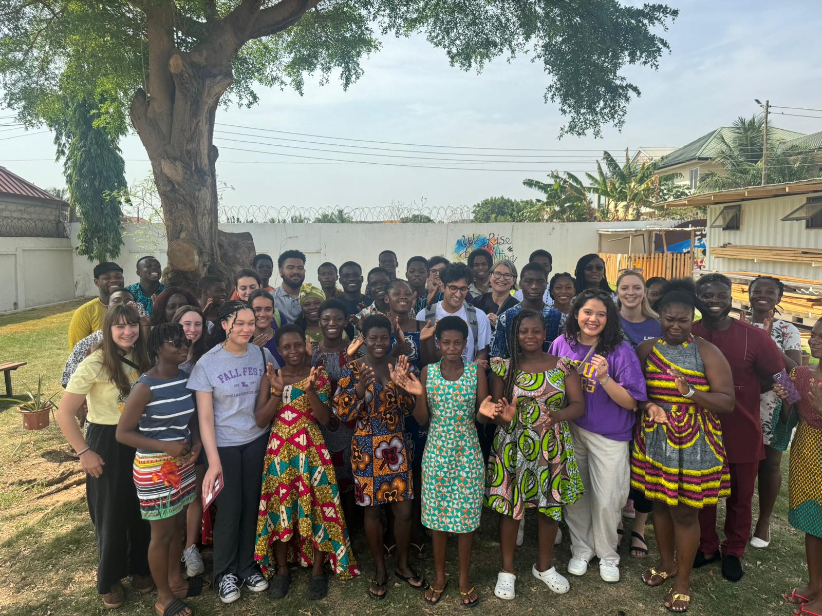 Gunaldo stands with students at school in Ghana