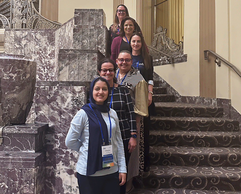 Faculty members Dr. Corina Caraccioli, Dr. Bethany Hager, Dr. Petra A. Robinson, and Dr. Renata Lyons, along with doctoral candidates Omaima Hajjami and Terri Ricks