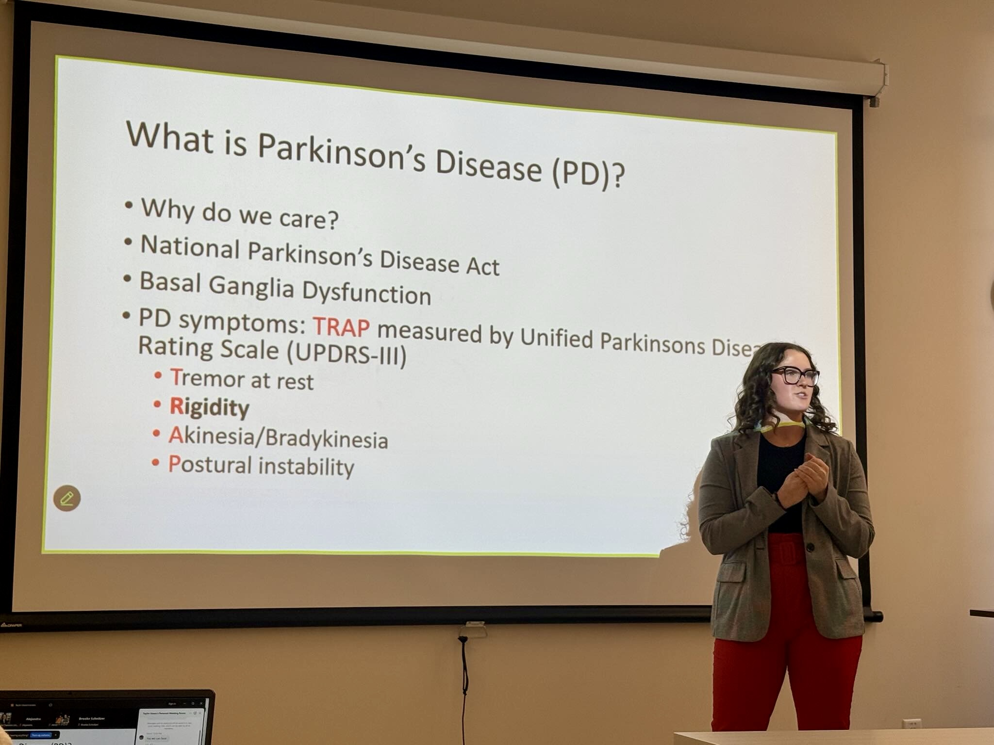 Taylor Gauss giving a presentation on Parkinson's disease