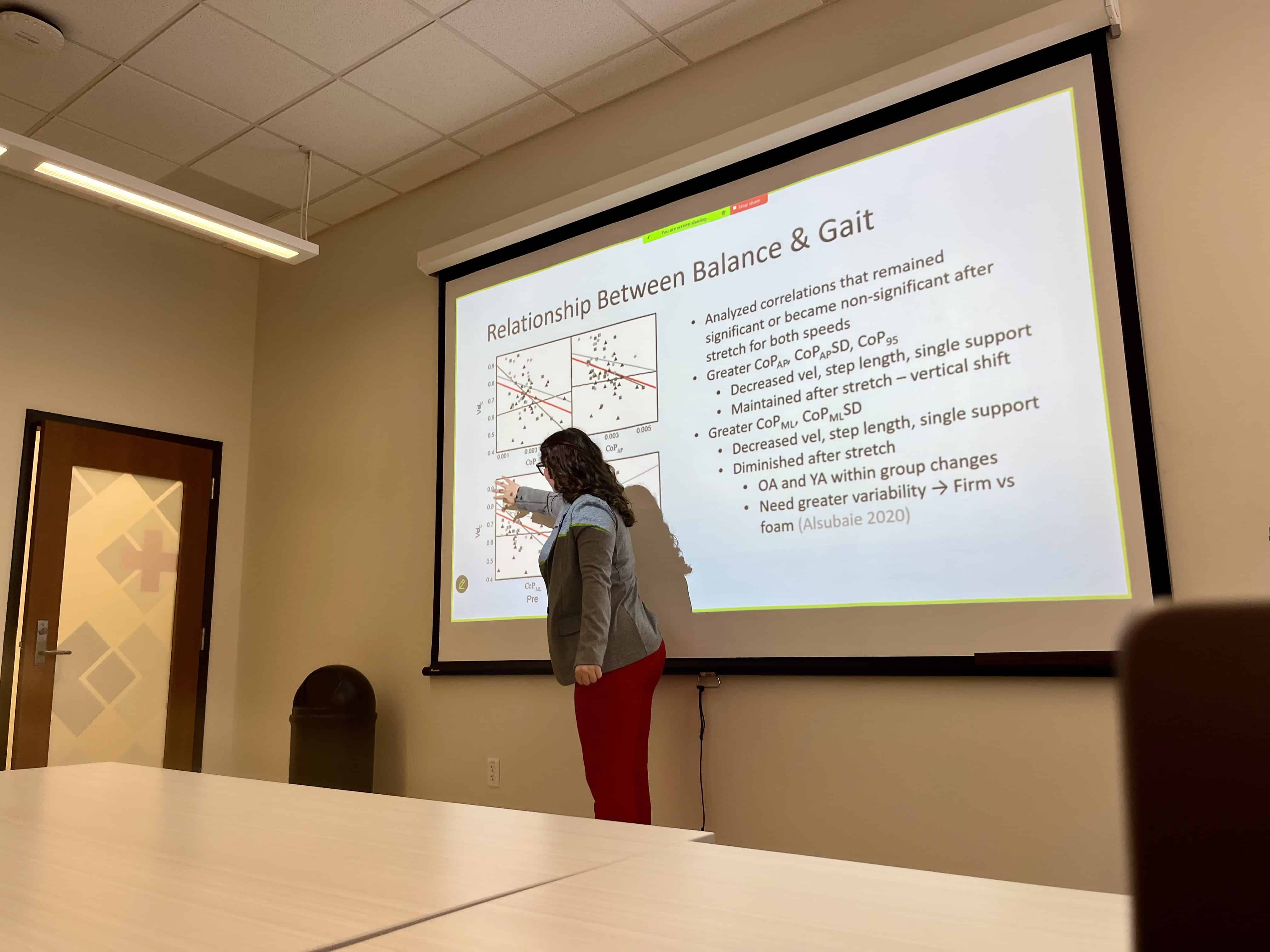 Taylor Gauss giving a presentation on ankles, stretching and gait as they are related to Parkinson's disease