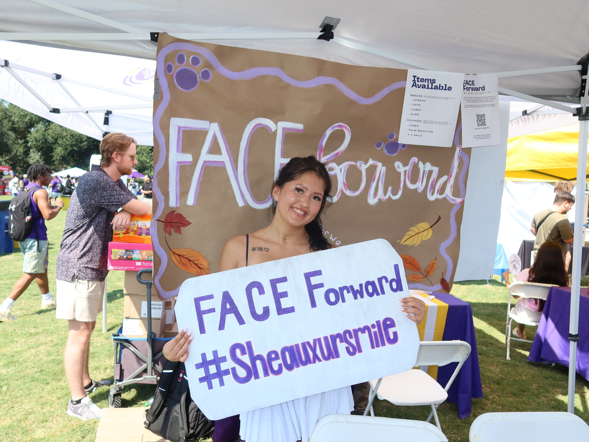 LSU Kinesiology major Kaitlyn Bartolutti holding a sign promoting FACE Forward