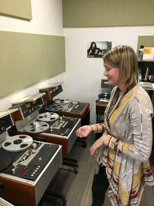 Mackenzie Roberts Beasley working with audio recordings.