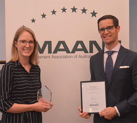 Photo of Katherine Raw and Per Svensson receiving the Best Research Paper Award. 