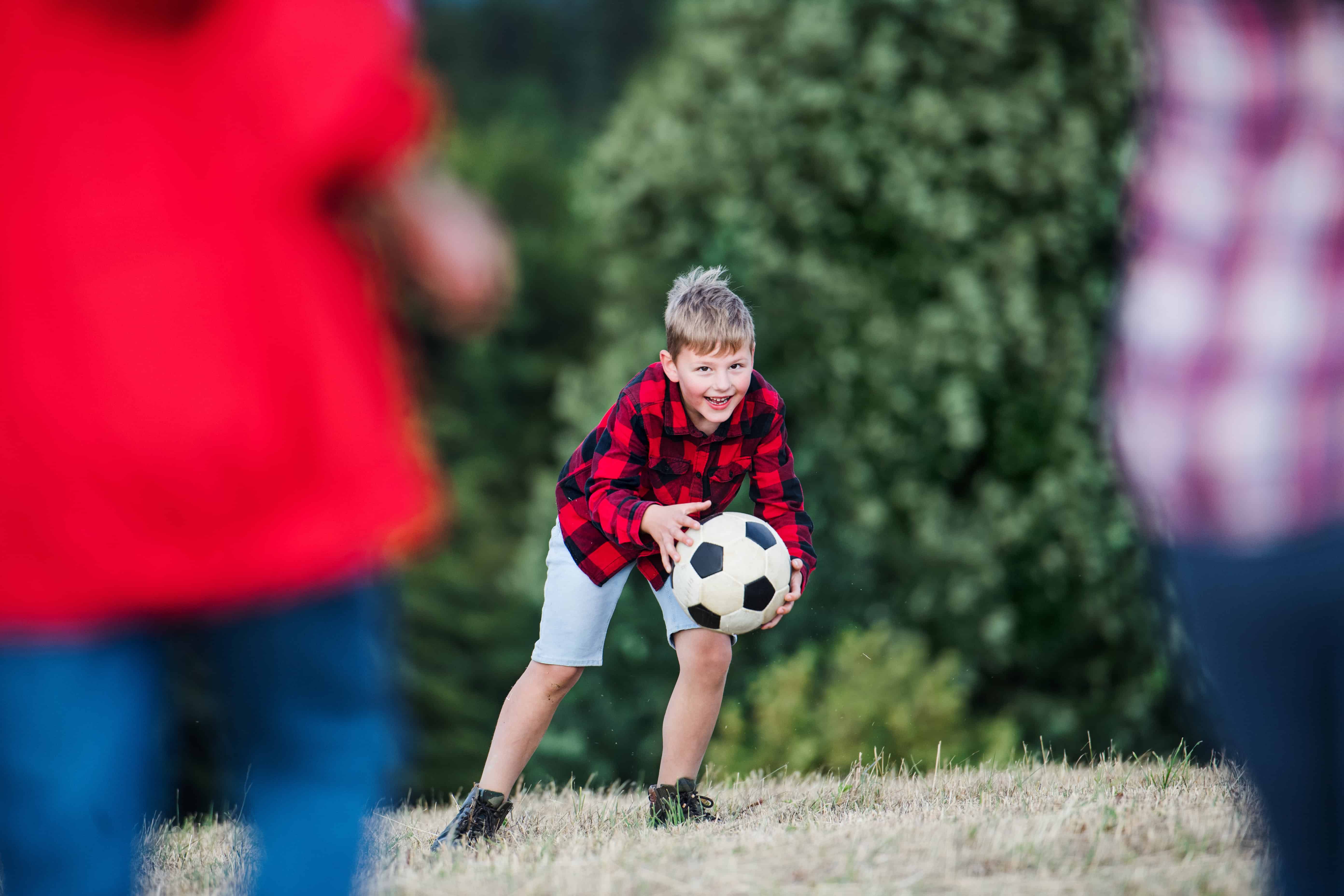 boy playing with a soccer ball